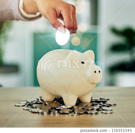 . Investment, savings and growth hand with silver coin in a piggy bank investing in future wealth or financial development. Finance person invest or saving change, money or cash in overflowing jar. . Investment, savings and growth hand with silver coin in a piggy bank investing in future wealth or financial development. Finance person invest or saving change, money or cash in overflowing jar. 110351543
