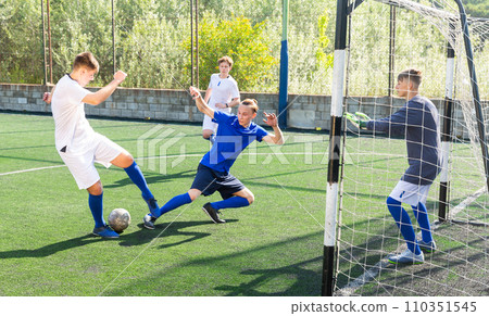 Football game - defender knocks ball from attacker Football game - defender knocks ball from attacker 110351545