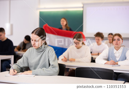Young girl student diligently studies at school 110351553