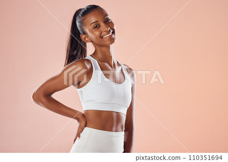Fit, athletic and stylish female athlete in sportswear smiling and feeling happy, ready and excited for a workout. Portrait of a cute African American athlete with an active style 110351694