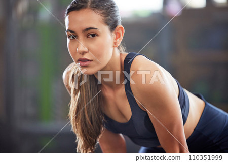 Fitness, gym and athletic woman taking a break and resting after a workout. Portrait of a fit and healthy woman looking tired after exercising and being active at a health and wellness facility Fitness, gym and athletic woman taking a break and resting after a workout. Portrait of a fit and healthy woman looking tired after exercising and being active at a health and wellness facility 110351999