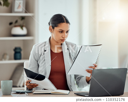 Stock market, finance paperwork and budget for financial advisor, trader or investor reading, analyzing or planning with laptop. Serious worker reading, monitoring investment or cryptocurrency profit 110352176