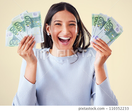 . Money, investment growth and finance success of a happy, excited and smiling woman holding cash. Portrait of a young happy female enjoying her growing financial wealth and savings with a big smile. . Money, investment growth and finance success of a happy, excited and smiling woman holding cash. Portrait of a young happy female enjoying her growing financial wealth and savings with a big smile. 110352233