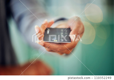 . Female hand holding a credit card to pay her debt, loans and mortgage at the bank during inflation. Closeup of a woman paying her financial bills. Lady making an investment in savings account. 110352249