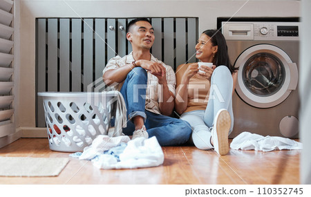 Couple, chores and laundry while doing home cleaning and feeling happy while talking and relaxing together. Boyfriend and girlfriend with healthy communication while sitting together on wash day Couple, chores and laundry while doing home cleaning and feeling happy while talking and relaxing together. Boyfriend and girlfriend with healthy communication while sitting together on wash day 110352745