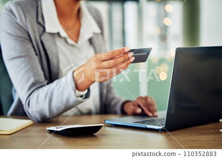 Digital banking, online shopping or internet business planning of a woman holding a credit card. A female accountant at a office computer checking finance data and working with financial information Digital banking, online shopping or internet business planning of a woman holding a credit card. A female accountant at a office computer checking finance data and working with financial information 110352883