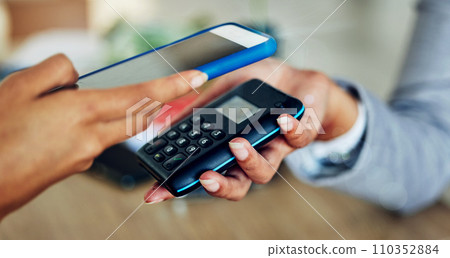 . Customer tapping phone for mobile nfc payment, digital transaction and money transfer for a quick, cashless and contactless sale in a store. Closeup of quick, easy and convenient retail shopping. . Customer tapping phone for mobile nfc payment, digital transaction and money transfer for a quick, cashless and contactless sale in a store. Closeup of quick, easy and convenient retail shopping. 110352884