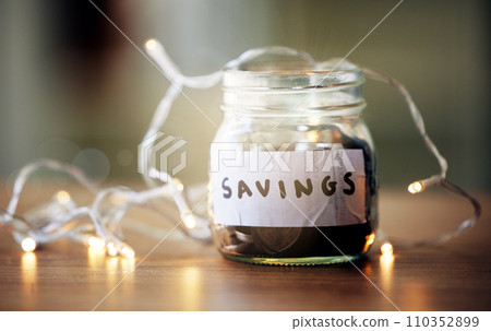Finance, investment and future planning with a collection of many coins, money in a jar on a table. Retirement fund or growth profit, budget, saving for financial security. Banking on a tax returns Finance, investment and future planning with a collection of many coins, money in a jar on a table. Retirement fund or growth profit, budget, saving for financial security. Banking on a tax returns 110352899