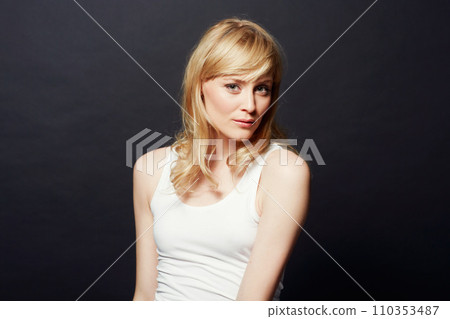 Woman, portrait and beauty with hair and cosmetic care for shine and salon treatment on dark background. Young model from Sweden in studio, healthy texture and haircare for growth with glow Woman, portrait and beauty with hair and cosmetic care for shine and salon treatment on dark background. Young model from Sweden in studio, healthy texture and haircare for growth with glow 110353487