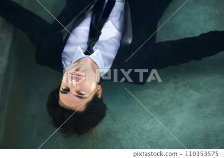 Water, challenge and a business man in debt during depression of the economy or financial crisis. Finance, pool and unemployment with a young corporate employee wet in a suit for recession from above Water, challenge and a business man in debt during depression of the economy or financial crisis. Finance, pool and unemployment with a young corporate employee wet in a suit for recession from above 110353575