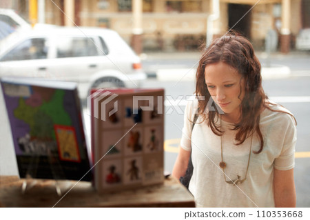 Book store, window shopping and woman with retail sale, discount and customer with choice. City, town and sidewalk with a female person at shop and boutique for purchase, library and glass on road Book store, window shopping and woman with retail sale, discount and customer with choice. City, town and sidewalk with a female person at shop and boutique for purchase, library and glass on road 110353668