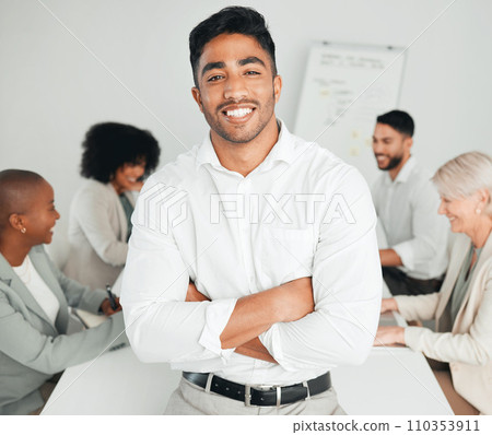 No job is too hard for us. a young businessman standing with his arms crossed at work. No job is too hard for us. a young businessman standing with his arms crossed at work. 110353911