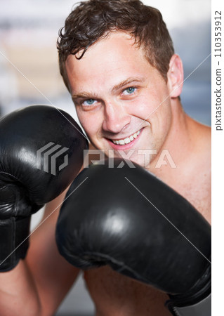 Boxing, gloves and portrait of man with smile for fitness, power and training challenge in gym. Strong body, muscle and confidence, happy boxer or athlete with fist up and competition fight champion. Boxing, gloves and portrait of man with smile for fitness, power and training challenge in gym. Strong body, muscle and confidence, happy boxer or athlete with fist up and competition fight champion. 110353912