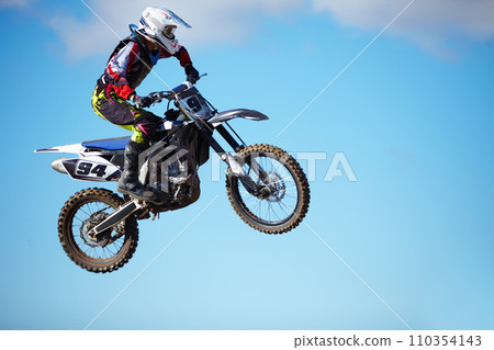 Person, motorcycle and air jump stunt as professional in action danger, competition or fearless in sky. Bike rider, off road transportation or fast speed adventure or rally, extreme sports challenge Person, motorcycle and air jump stunt as professional in action danger, competition or fearless in sky. Bike rider, off road transportation or fast speed adventure or rally, extreme sports challenge 110354143