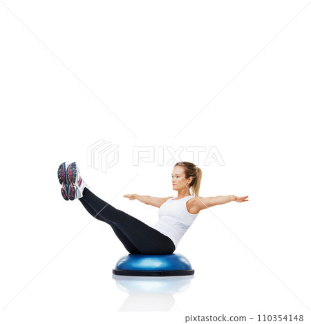 Balance, workout and woman with bosu ball for exercise, core training and wellness on white background. Muscle, strength and power with challenge on mockup space, athlete and fitness tools in studio 110354148