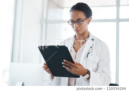These stats look good to me. a female young doctor recording a patients information on a clipboard. These stats look good to me. a female young doctor recording a patients information on a clipboard. 110354204