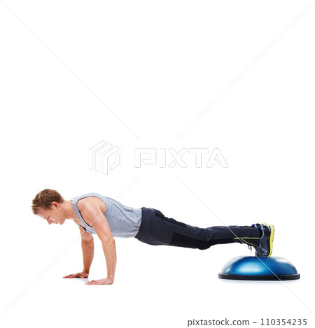 Man, fitness and push ups with bosu ball for exercise, workout or training on a white studio background. Active male person lifting body weight for strength, muscle or strong arms on mockup space Man, fitness and push ups with bosu ball for exercise, workout or training on a white studio background. Active male person lifting body weight for strength, muscle or strong arms on mockup space 110354235
