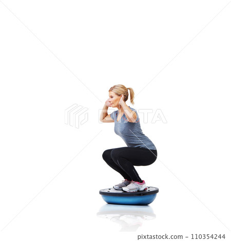 Woman, squat and exercise on bosu ball for workout, training or practice on a white studio background. Active female person on half round object for pilates, fitness or strong glutes on mockup space Woman, squat and exercise on bosu ball for workout, training or practice on a white studio background. Active female person on half round object for pilates, fitness or strong glutes on mockup space 110354244