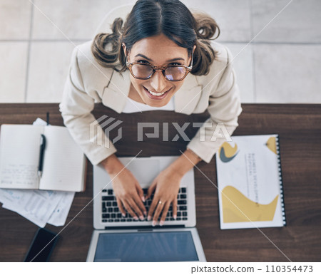 Top view, portrait or business woman on laptop in company finance management, investment strategy or global financial growth. Smile, happy or worker typing on technology for budget planning or ideas 110354473