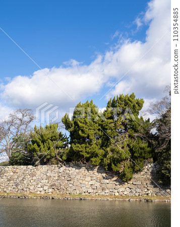 The stone walls and middle moat of Hikone Castle. Photographed in December from Shiga Prefectural Route 25 Hikone Omihachiman Line. (Vertical composition) The stone walls and middle moat of Hikone Castle. Photographed in December from Shiga Prefectural Route 25 Hikone Omihachiman Line. (Vertical composition) 110354885