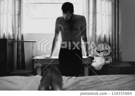 Man, bedroom and depressed with thinking and cheating with black and white and beard at home. Art, fashion and male person in a house with a problem and anxiety with lonely grief and monochrome Man, bedroom and depressed with thinking and cheating with black and white and beard at home. Art, fashion and male person in a house with a problem and anxiety with lonely grief and monochrome 110355064