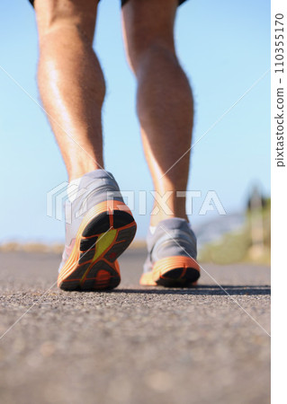 Man, shoes and legs running on road for fitness, workout or outdoor exercise on asphalt. Closeup of male person or athlete on street with sneakers for run, cardio or floor grip in health and wellness Man, shoes and legs running on road for fitness, workout or outdoor exercise on asphalt. Closeup of male person or athlete on street with sneakers for run, cardio or floor grip in health and wellness 110355170