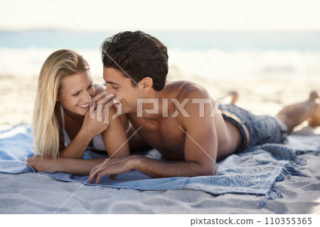 Love, laughing and couple lying on beach for date, outdoor bonding or tropical holiday. Romance, man and woman at picnic, happy and relax on ocean vacation together with travel, care and adventure. Love, laughing and couple lying on beach for date, outdoor bonding or tropical holiday. Romance, man and woman at picnic, happy and relax on ocean vacation together with travel, care and adventure. 110355365