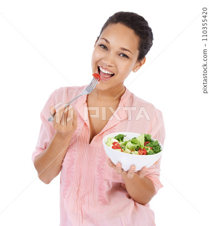 Happy woman, portrait and salad in studio eating healthy food, detox lunch or breakfast on a white background. African person or model with tomato, vegetables and fruit or green lettuce for diet meal Happy woman, portrait and salad in studio eating healthy food, detox lunch or breakfast on a white background. African person or model with tomato, vegetables and fruit or green lettuce for diet meal 110355420