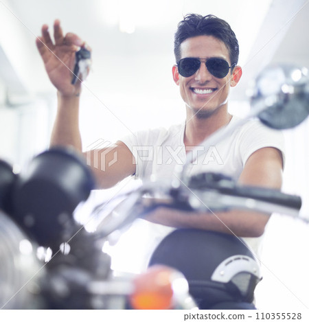 Happy man, portrait and motorcycle keys with helmet and sunglasses for transportation vehicle in garage. Young male person or biker smile for cool automobile or ownership of mechanical motorbike Happy man, portrait and motorcycle keys with helmet and sunglasses for transportation vehicle in garage. Young male person or biker smile for cool automobile or ownership of mechanical motorbike 110355528
