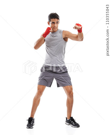 Boxer, man and kickboxing in studio with sports for fitness, health and martial arts isolated on white background. Strong athlete with muscle, action and fighting with MMA training and exercise 110355843