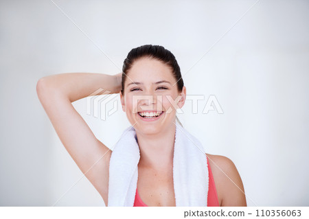 Laughing, white background or portrait of happy athlete with towel for fitness or wellness with confidence. Smile, funny model or healthy sports woman ready to start workout, training or exercise 110356063