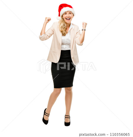 Celebrating business achievements no matter the day. a senior businesswoman wearing a christmas hat cheering against a studio background. 110356065