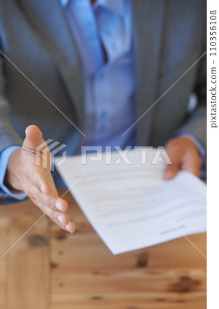 Business person, handshake offer and document for job interview, corporate meeting and hiring or recruitment. Professional manager, employer shaking hands or POV introduction with resume, CV or paper 110356108