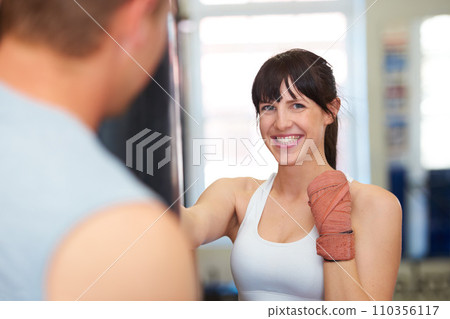 Happy woman, portrait and boxing with personal trainer for self defense, workout or exercise at gym. Face of female person or boxer smile for MMA, fighting or indoor training in martial arts practice Happy woman, portrait and boxing with personal trainer for self defense, workout or exercise at gym. Face of female person or boxer smile for MMA, fighting or indoor training in martial arts practice 110356117