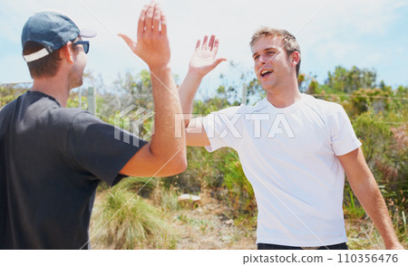 Sports, high five and fitness in nature with happy, collaboration for training for exercise in summer. Athlete, congratulations and together for outdoor wellness, adventure or teamwork in countryside 110356476