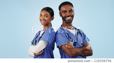 Portrait, healthcare and arms crossed with a medicine team in studio on a blue background for trust. Medical, smile or wellness with a young man and woman nurse looking confident for treatment 110356756
