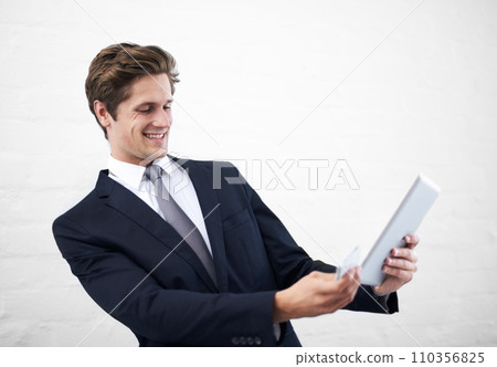 Happy businessman, tablet and phone for communication, research or social media on a white studio background. Man or employee in business fashion with mobile smartphone and technology on mockup space 110356825