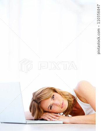Woman, laptop and portrait in studio white background for online connection, floor or study email. Female person, model and face for mockup space for digital learning or social media, research on web 110356847