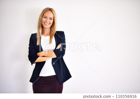 Shes dressed for success. well dressed woman looking at the camera. 110356916