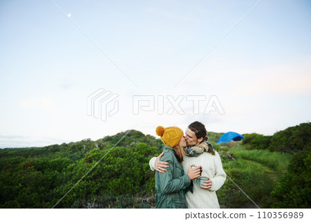 Sharing a loving kiss outdoors. an affectionate young couple kissing outdoors. 110356989