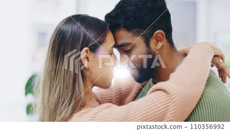 Couple, forehead and hug in home for love, support and care of trust, romance and gratitude of soulmate. Face of happy man, interracial woman and together for peace, loyalty and commitment to partner 110356992