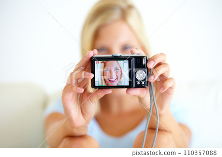 Portrait, smile and woman with a digital camera, happiness and memory with break, excited or cheerful. Face, person or girl with equipment, photography or joyful with peace, screen or home with frame 110357088