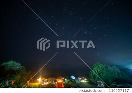 travel and people activity concept with star in the night with camping tent 110357117