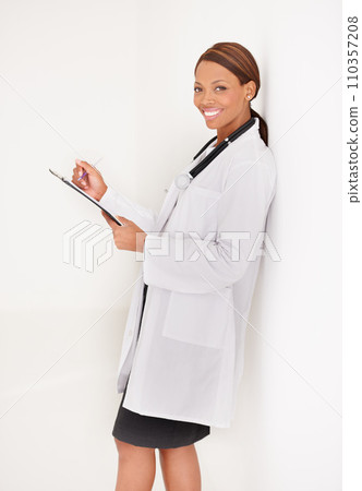 Doctor portrait, woman with documents and writing in medical charts, test results or health evaluation in clinic. Happy healthcare worker with hospital folder or checklist on wall or white background 110357208