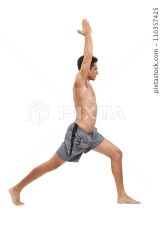 Man, meditation and yoga in studio for exercise or spiritual awareness, zen and warrior pose. Male person, pilates and peace or wellness and balance or fitness, active and cardio by white background 110357425