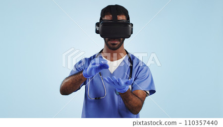 Doctor, man and virtual reality glasses for surgery, healthcare innovation and surgeon on a blue studio background. Person, medical and professional with VR eyewear, future and tech with digital app 110357440