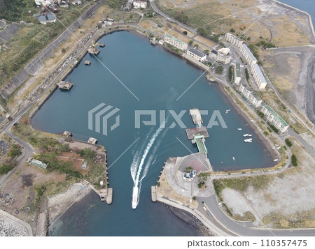 Aerial photo of the ferry departing from Ikeshima and its wake Aerial photo of the ferry departing from Ikeshima and its wake 110357475