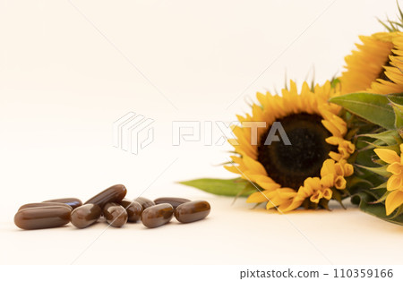 Mockup Sunflower Lecithin Brown Softgel Pill, Capsule On White Beige Background with Sunflowers. Copy Space for Text. Vitamin, Dietary Supplements. Lecithin Benefits Design. Horizontal Plane Mockup Sunflower Lecithin Brown Softgel Pill, Capsule On White Beige Background with Sunflowers. Copy Space for Text. Vitamin, Dietary Supplements. Lecithin Benefits Design. Horizontal Plane 110359166