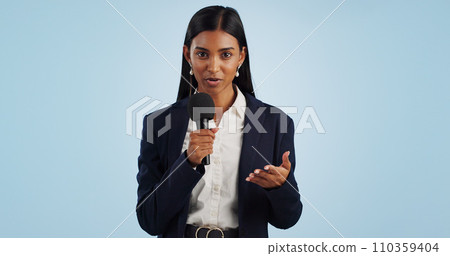 Woman, portrait or presenter in studio talking, speaking on talk show or media on blue background. Breaking news, tv press or Indian reporter presenting live global political events with microphone Woman, portrait or presenter in studio talking, speaking on talk show or media on blue background. Breaking news, tv press or Indian reporter presenting live global political events with microphone 110359404