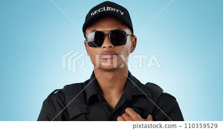 Security guard, portrait and man in studio with glasses for surveillance, justice and law enforcement on blue background. Serious bodyguard for crime prevention, safety patrol and monitoring danger Security guard, portrait and man in studio with glasses for surveillance, justice and law enforcement on blue background. Serious bodyguard for crime prevention, safety patrol and monitoring danger 110359529